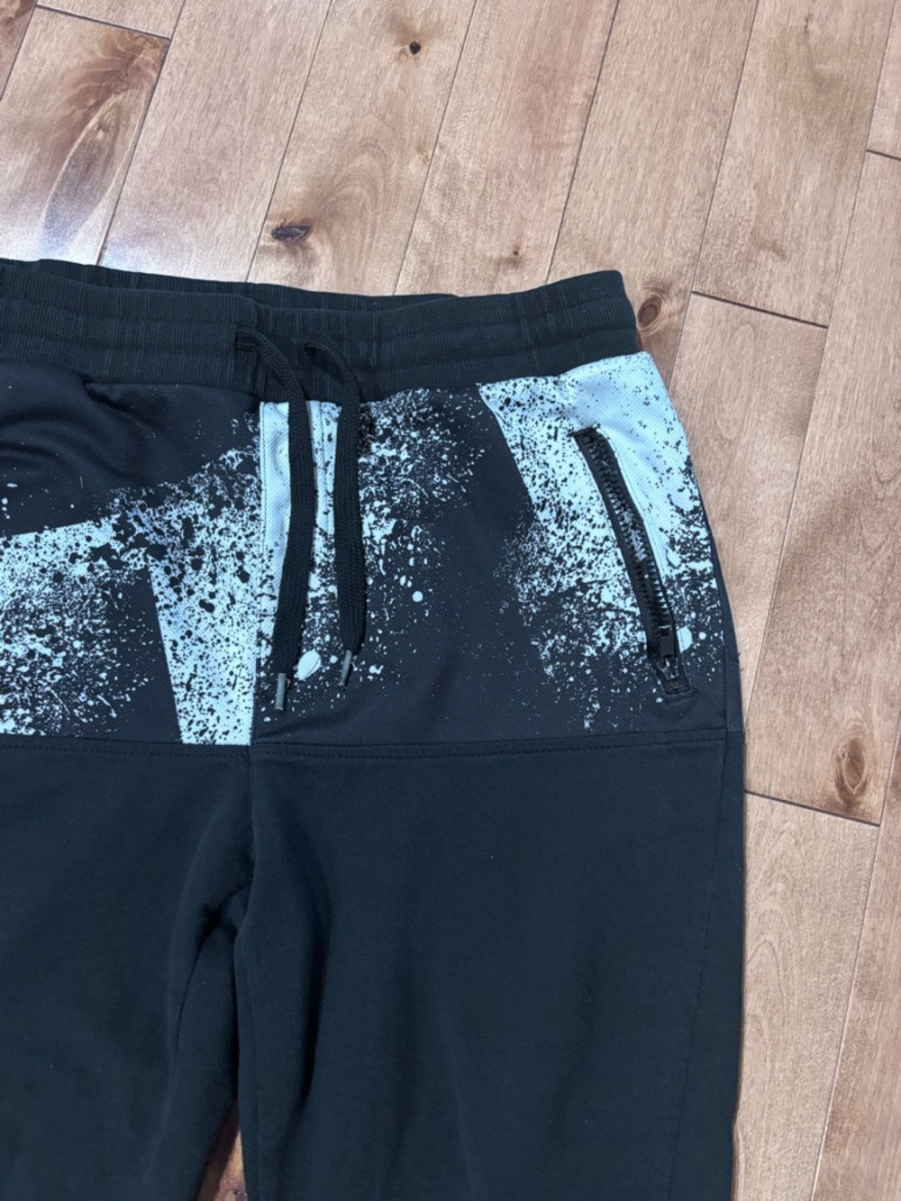 Men’s black jogger sweatpants with paint splattered look Large